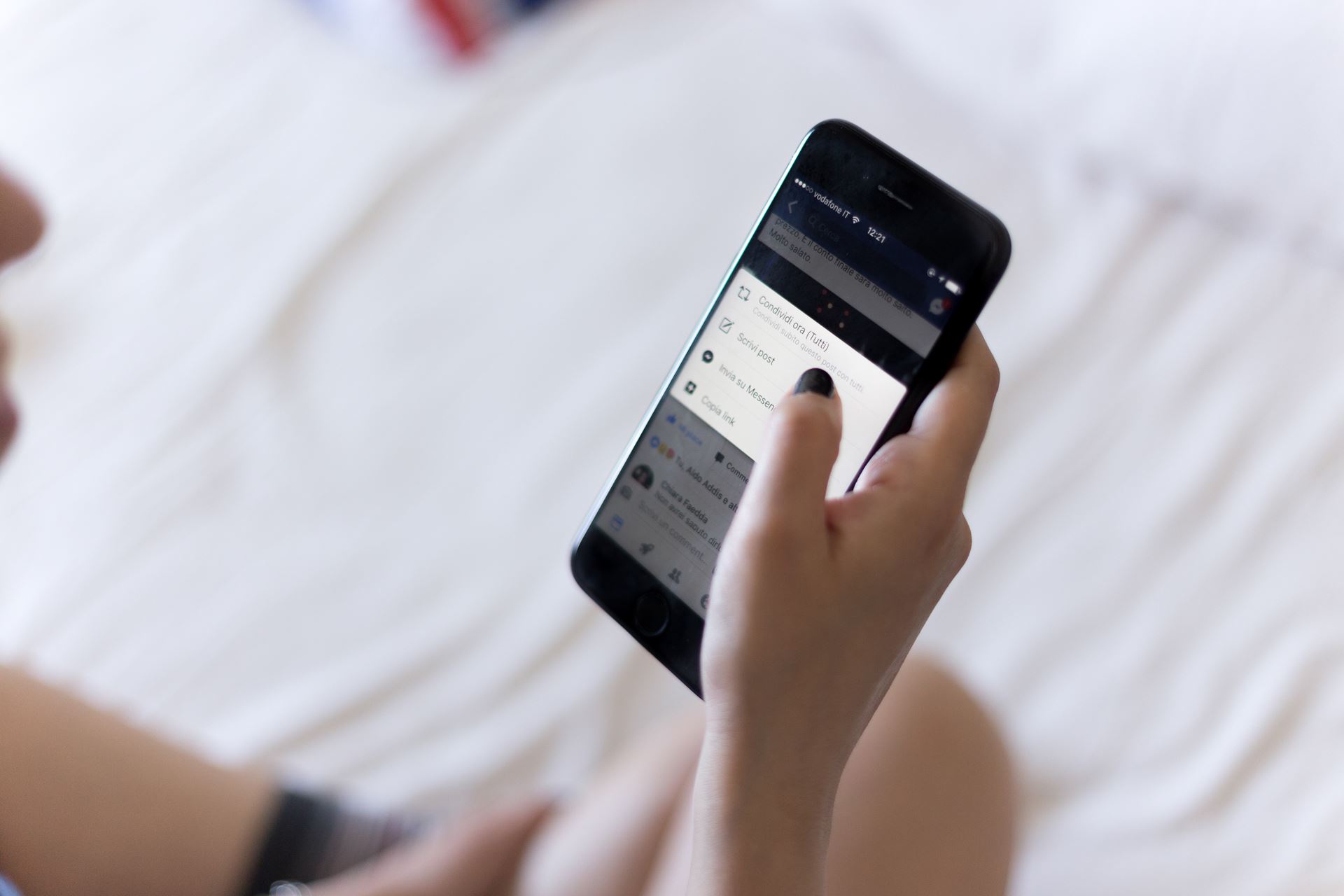 a hand holding a cellphone
